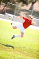 Personal trainer for women - Christa - does a soccer side kick.